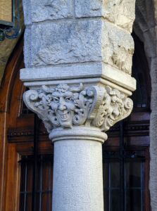 Evil faces on pillar